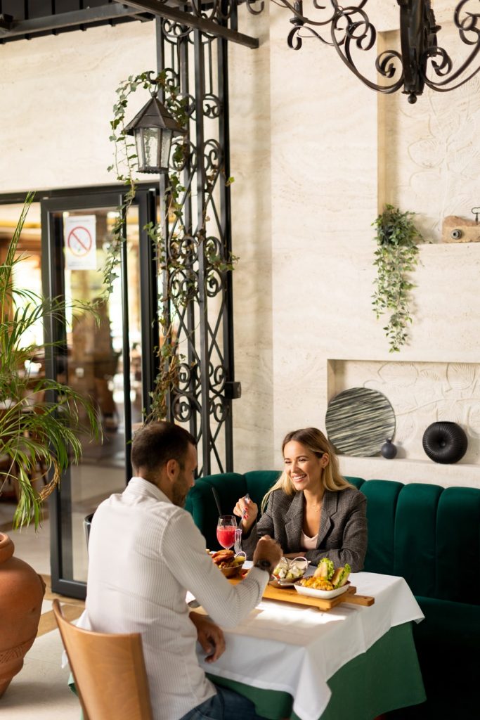 A couple having lunch and drinking